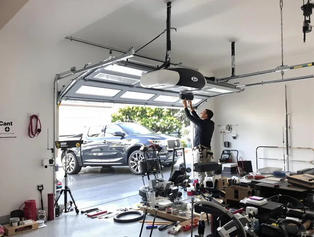 Black Forest Garage Door Repair specialist installing smart garage door opener system in Black Forest home