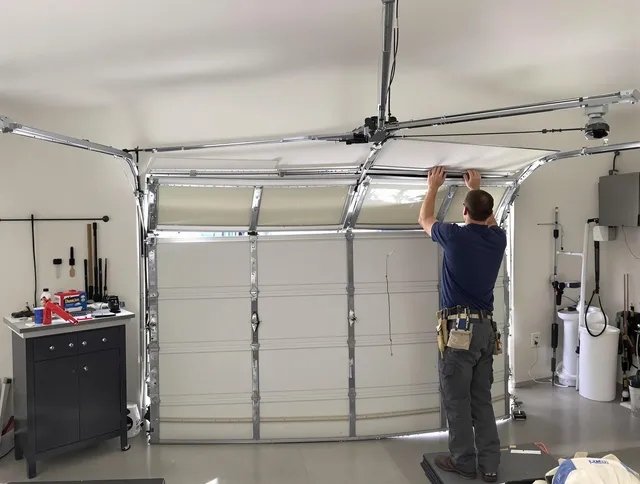 Black Forest Garage Door Repair specialist performing precise section replacement on Black Forest garage door